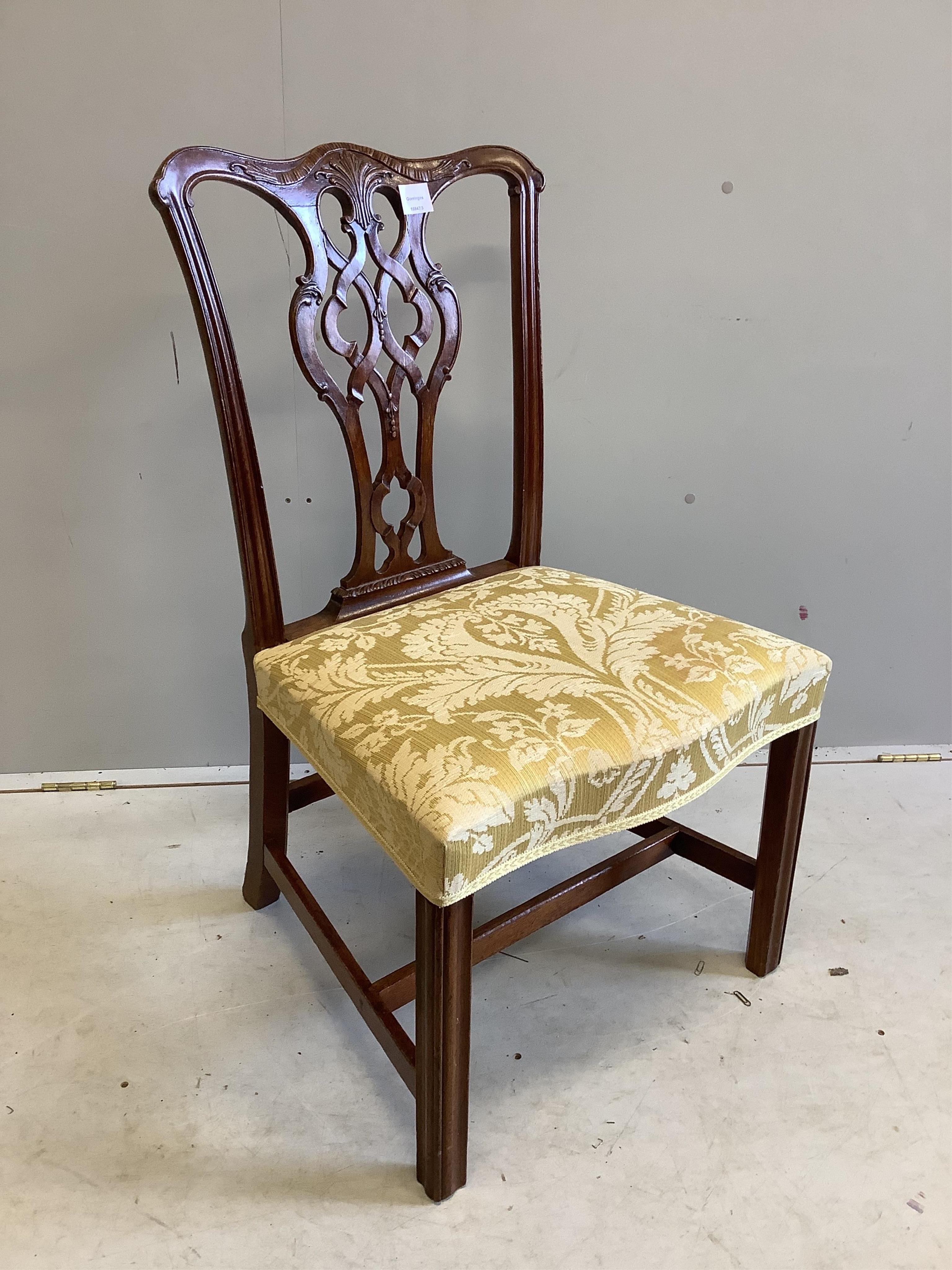 A single Chippendale period mahogany dining chair, with a carved pierced splat back, width 56cm, depth 46cm, height 94cm. Condition - good